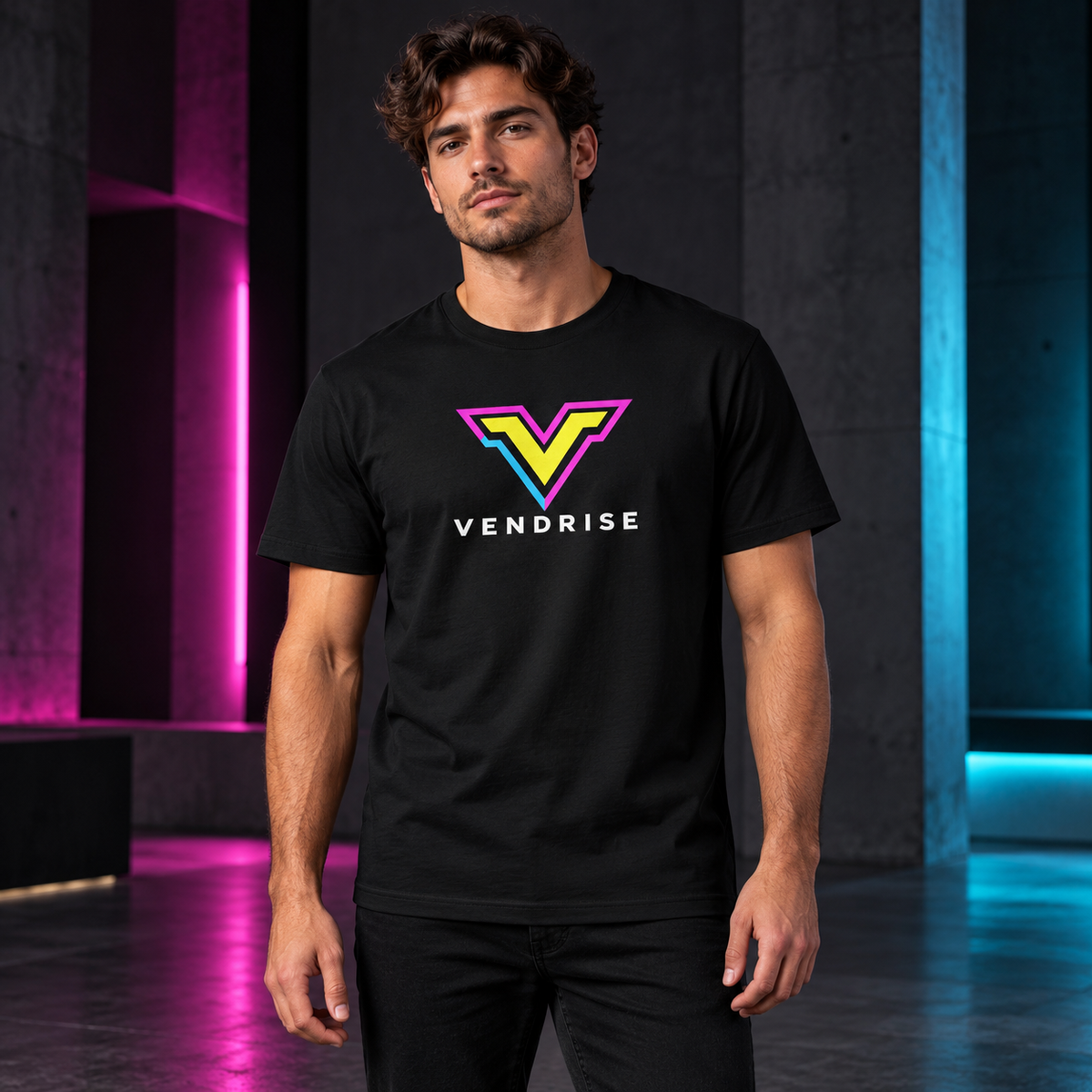 Model wearing the black VendRise neon logo T-shirt in a studio with pink and cyan lighting